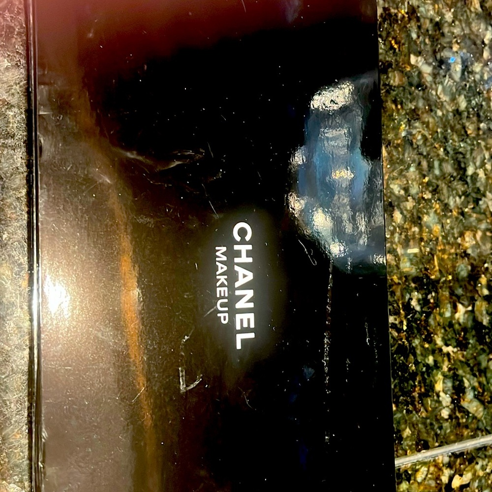 Chanel make-up satin lined. Never used. Raised velvet lettering.     Unique